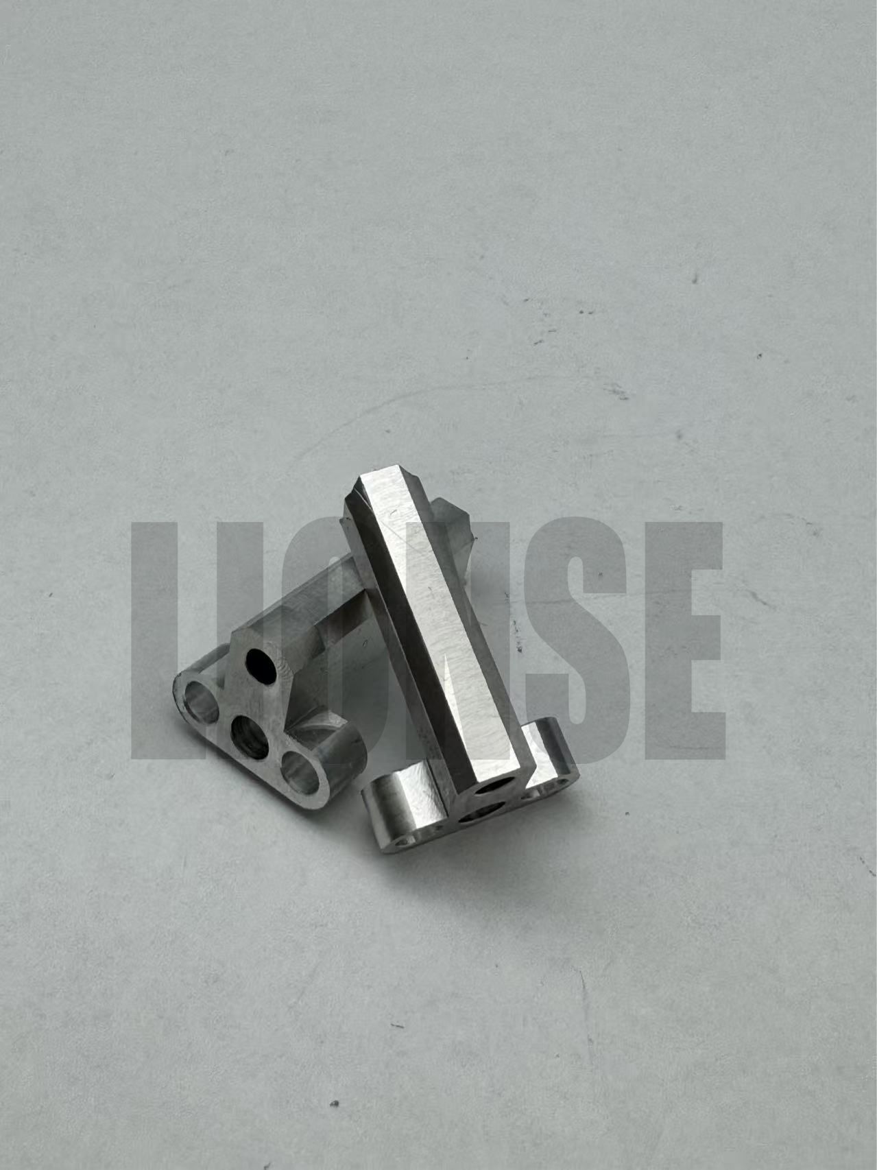 Small Precision Machined Perforated Metal Connecting Bracket